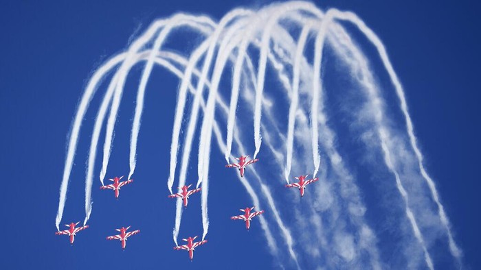 Indian Air Force's aerobatic team Suryakiran perform maneuvers on the first day of the Aero India 2023 at Yelahanka air base in Bengaluru, India, Monday, Feb. 13, 2023. Aero India is a biennial event with flying demonstrations by stunt teams and militaries and commercial pavilions where aviation companies display their products and technology. (AP Photo/Aijaz Rahi)