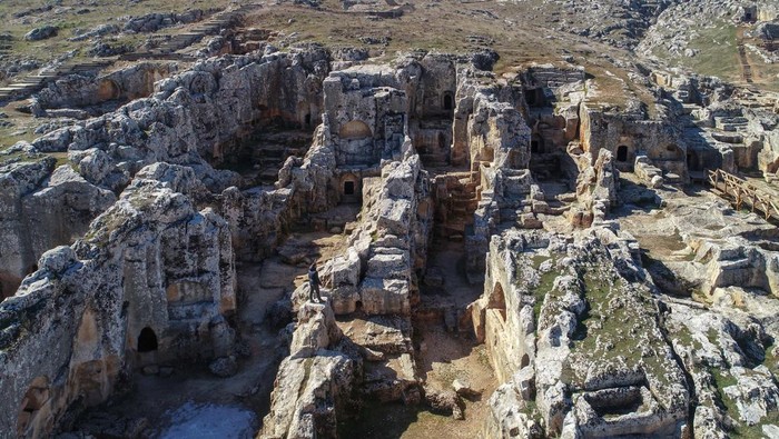 ADIYAMAN, TURKIYE - FEBRUARY 16: An aerial view of not-affected Perre Ancient City, one of the 5 largest cities of the Commagene Kingdom, without damage after 7.7 and 7.6 magnitude earthquakes in Adiyaman, Turkiye, on February 16, 2023. The ancient city walls, still-used fountain and approximately 200 rock tombs in historical Perre were not damaged by the earthquakes. On Feb. 06, a strong 7.7 earthquake, centered in the Pazarcik district, jolted Kahramanmaras and strongly shook several provinces, including Gaziantep, Sanliurfa, Diyarbakir, Adana, Adiyaman, Malatya, Osmaniye, Hatay, and Kilis. Later, at 13.24 p.m. (1024GMT), a 7.6 magnitude quake centered in Kahramanmaras' Elbistan district struck the region. (Photo by Ozkan Bilgin/Anadolu Agency via Getty Images)