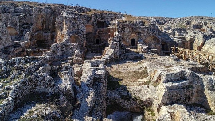 ADIYAMAN, TURKIYE - FEBRUARY 16: An aerial view of not-affected Perre Ancient City, one of the 5 largest cities of the Commagene Kingdom, without damage after 7.7 and 7.6 magnitude earthquakes in Adiyaman, Turkiye, on February 16, 2023. The ancient city walls, still-used fountain and approximately 200 rock tombs in historical Perre were not damaged by the earthquakes. On Feb. 06, a strong 7.7 earthquake, centered in the Pazarcik district, jolted Kahramanmaras and strongly shook several provinces, including Gaziantep, Sanliurfa, Diyarbakir, Adana, Adiyaman, Malatya, Osmaniye, Hatay, and Kilis. Later, at 13.24 p.m. (1024GMT), a 7.6 magnitude quake centered in Kahramanmaras' Elbistan district struck the region. (Photo by Ozkan Bilgin/Anadolu Agency via Getty Images)