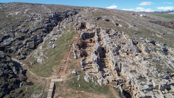 ADIYAMAN, TURKIYE - FEBRUARY 16: An aerial view of not-affected Perre Ancient City, one of the 5 largest cities of the Commagene Kingdom, without damage after 7.7 and 7.6 magnitude earthquakes in Adiyaman, Turkiye, on February 16, 2023. The ancient city walls, still-used fountain and approximately 200 rock tombs in historical Perre were not damaged by the earthquakes. On Feb. 06, a strong 7.7 earthquake, centered in the Pazarcik district, jolted Kahramanmaras and strongly shook several provinces, including Gaziantep, Sanliurfa, Diyarbakir, Adana, Adiyaman, Malatya, Osmaniye, Hatay, and Kilis. Later, at 13.24 p.m. (1024GMT), a 7.6 magnitude quake centered in Kahramanmaras' Elbistan district struck the region. (Photo by Ozkan Bilgin/Anadolu Agency via Getty Images)