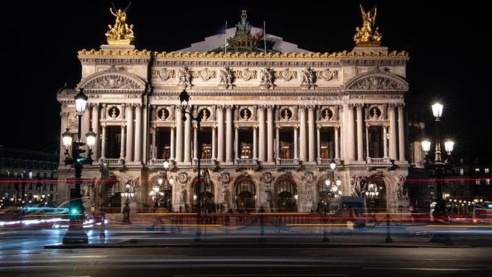 A picture taken at night on April 26, 2022 shows a view of the Opera Garnier in Paris. (Photo by AFP) (Photo by -/AFP via Getty Images)