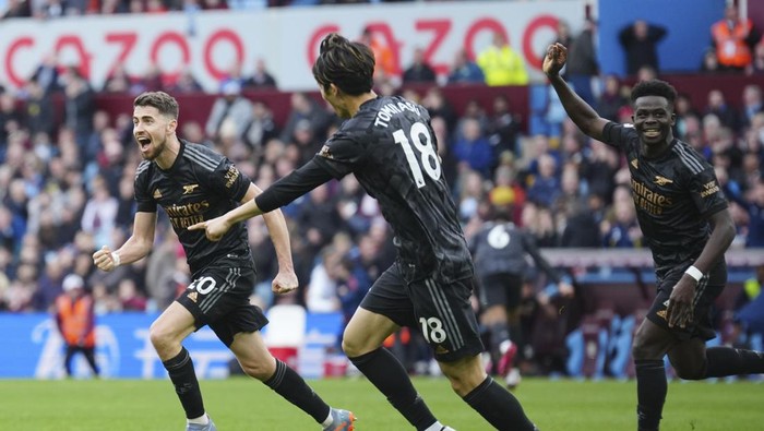 Arsenals Jorginho, left, celebrates after scoring during the English Premier League soccer match between Aston Villa and Arsenal at Villa Park in Birmingham, England, Saturday, Feb. 18, 2023. (AP Photo/Jon Super)