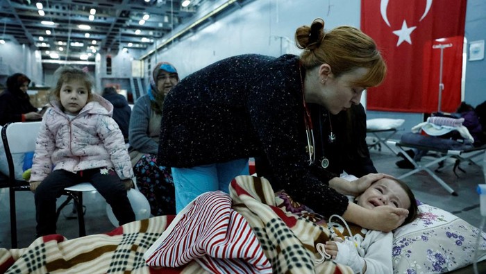 Suleyman, 1, rests in a makeshift hospital bed suffering from exposure, which has been set up in the Turkish military tank landing ship TCG Bayraktar, in the aftermath of a deadly earthquake, docked in a port in the province of Hatay, in Iskenderun, Turkey, February 16, 2023. REUTERS/Clodagh Kilcoyne     TPX IMAGES OF THE DAY