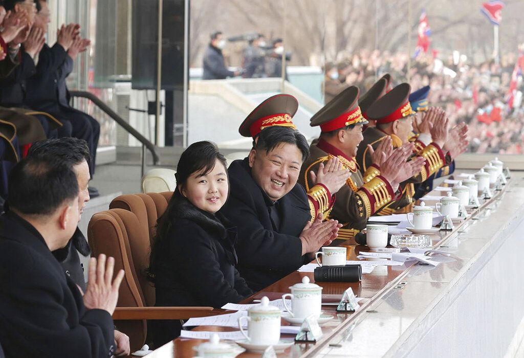 This photo provided by the North Korean government shows North Korean leader Kim Jong Un, center, and his daughter, left, watch the sports games by the staff of the cabinet and the Ministry of National Defence at an undisclosed location in North Korea, on Feb. 17, 2023. Independent journalists were not given access to cover the event depicted in this image distributed by the North Korean government. The content of this image is as provided and cannot be independently verified. Korean language watermark on image as provided by source reads: 