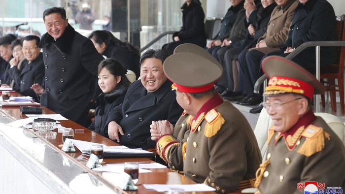 This photo provided by the North Korean government shows North Korean leader Kim Jong Un, center, and his daughter, left, watch the sports games by the staff of the cabinet and the Ministry of National Defence at an undisclosed location in North Korea, on Feb. 17, 2023. Independent journalists were not given access to cover the event depicted in this image distributed by the North Korean government. The content of this image is as provided and cannot be independently verified. Korean language watermark on image as provided by source reads: 