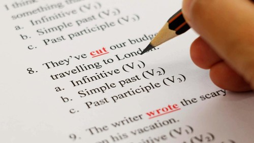 closeup english exam sheet on table with pencil