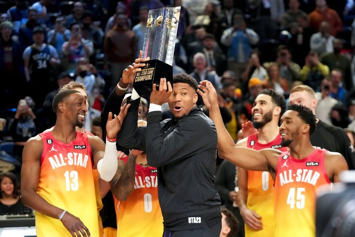 Giannis Antetokounmpo hold up the winning team trophy after the NBA basketball All-Star game Sunday, Feb. 19, 2023, in Salt Lake City. (AP Photo/Rick Bowmer)