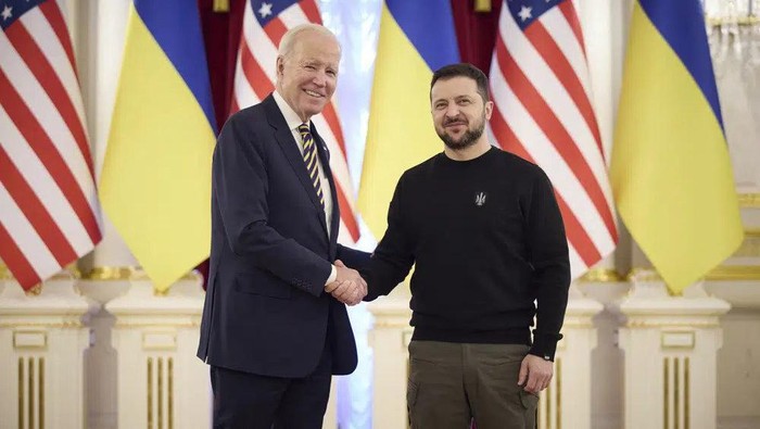 In this image from video provided by the Ukrainian Presidential Press Office and posted on Facebook, on Monday, Feb. 20, 2023, Ukrainian President Volodymyr Zelenskyy, right, and U.S. President Joe Biden shake hands during their meeting in Kyiv, Ukraine. (Ukrainian Presidential Press Office via AP)