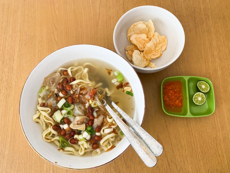 Indonesian typical noodle with cow thick skin and peanut  as topping, named 