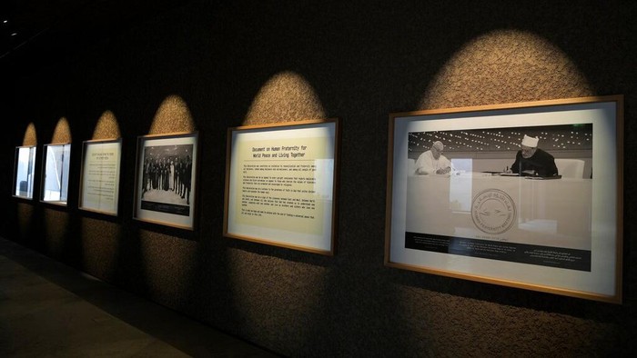 A photo of Ahmed El-Tayeb Grand Imam of al-Azhar, right, and Pope Francis, on display at Abrahamic Family House, in Abu Dhabi, United Arab Emirates, Tuesday, Feb. 21, 2023. A new complex, called the Abrahamic Family House, erected on the shores of the Persian Gulf, in the capital of the United Arab Emirates, houses a Catholic church, a Jewish synagogue and an Islamic mosque. (AP Photo/Kamran Jebreili)