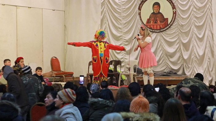 Entertainers present a show for those affected by the 7.8-magnitude quake, at the Saint Elijah Cathedral in the government-held northern city of Aleppo on February 21, 2023. - Aleppo, once a major commercial hub, had already been battered by over a decade of war when the 7.8-magnitude quake struck in early February, killing more than 45,000 people across Turkey and Syria and flattening entire neighbourhoods. (Photo by LOUAI BESHARA / AFP) (Photo by LOUAI BESHARA/AFP via Getty Images)