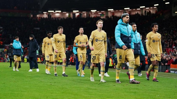 Barcelona players walk off dejected after the UEFA Europa League playoff match at Old Trafford, Manchester. Picture date: Thursday February 23, 2023. (Photo by Martin Rickett/PA Images via Getty Images)