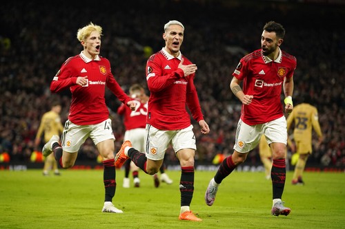 Manchester Uniteds Antony, center, celebrates after scoring his sides second goal during the Europa League playoff second leg soccer match between Manchester United and Barcelona at Old Trafford stadium in Manchester, England, Thursday, Feb. 23, 2023. (AP Photo/Dave Thompson)