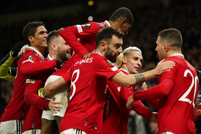 Manchester Uniteds Antony, second right, celebrates with his teammates after scoring his sides second goal during the Europa League playoff second leg soccer match between Manchester United and Barcelona at Old Trafford stadium in Manchester, England, Thursday, Feb. 23, 2023. (AP Photo/Dave Thompson)