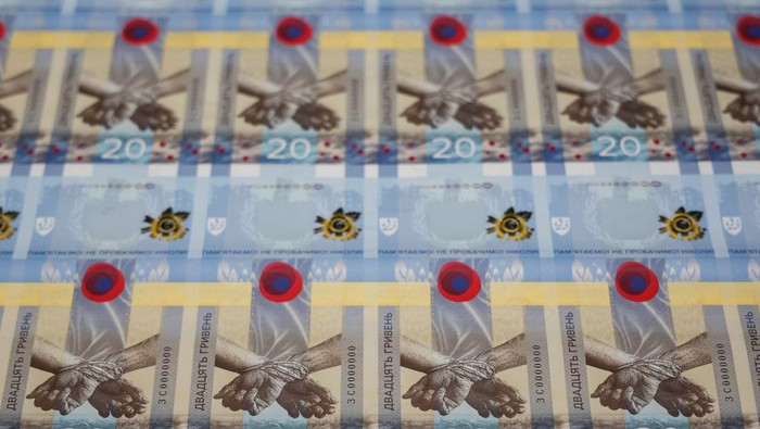 Banknotes dedicated to the first anniversary of Russia's invasion on Ukraine are seen during a presentation at the Ukrainian National Bank in Kyiv, Ukraine February 23, 2023. REUTERS/Valentyn Ogirenko