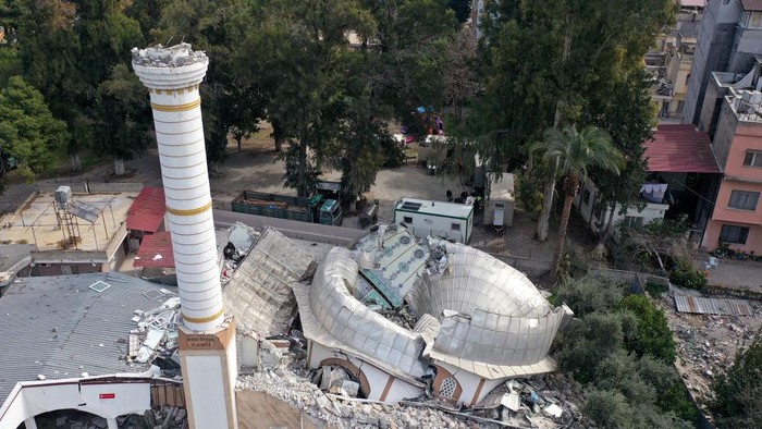 HATAY, TURKIYE - FEBRUARY 25: An aerial view shows the demolished 64-year-old Nuri Uysen Mosque after two powerful earthquakes jolted Turkiye's southern province Hatay on February 25, 2023. Citizens demanded that a tent mosque be built in the region temporarily ahead of the holy month of Ramadan. On Feb. 06, a strong 7.7 earthquake, centered in the Pazarcik district, jolted Kahramanmaras and strongly shook several provinces, including Gaziantep, Sanliurfa, Diyarbakir, Adana, Adiyaman, Malatya, Osmaniye, Hatay, Kilis, and Elazig. Later, at 1.24 p.m. (1024GMT), a 7.6 magnitude quake centered in Kahramanmaras' Elbistan district struck the region. (Photo by Mahmut Serdar Alakus/Anadolu Agency via Getty Images)
