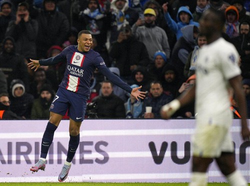 PSGs Kylian Mbappe celebrates after scoring his sides third goal during the French League One soccer match between Marseille and Paris Saint-Germain at the Velodrome stadium in Marseille, southern France, Sunday, Feb. 26, 2023. (AP Photo/Daniel Cole)