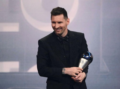 Argentina and Paris Saint-Germain forward Lionel Messi poses on stage after receiving the Best FIFA Mens Player award during the Best FIFA Football Awards 2022 ceremony in Paris on February 27, 2023. (Photo by FRANCK FIFE / AFP) (Photo by FRANCK FIFE/AFP via Getty Images)