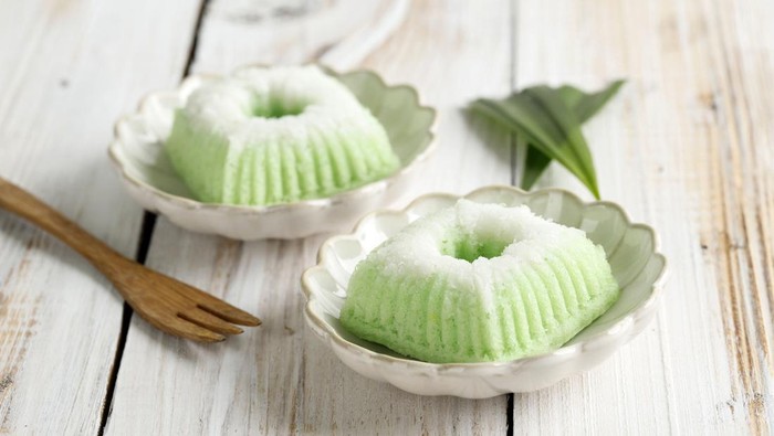 Kue Putu Ayu, Indonesian Traditional Jajan pasar made from Steamed Flour and Grated Coconut. On White Wooden Background