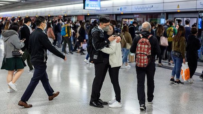 Passengers at Central station, operated by MTR Corp., in Hong Kong, China, on Tuesday, Feb. 28, 2023. Hong Kong will stop requiring masks to be worn in public places from Wednesday, drawing to a close the prolonged Covid era that damaged its economy and standing in the world. Photographer: Paul Yeung/Bloomberg via Getty Images