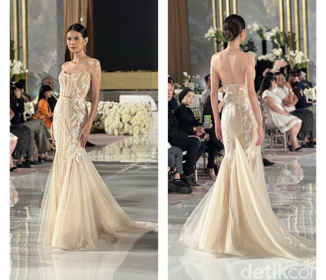Tak selalu berwarna putih, gaun pengantin berwarna coklat keemasan yang satu ini juga bisa dijadikan pilihan. Gaun yang berasal dari Berta itu berbentuk mermaid dengan bagian atas tak berlengan. Bagian belakang gaun memiliki sedikit buntut namun tetap terlihat simpel. Foto: Wolipop/Vina Oktiani