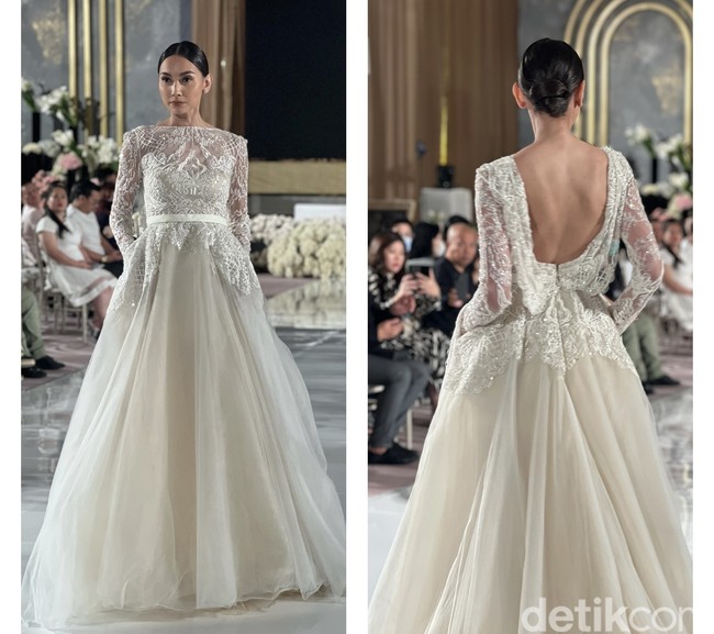 Dari depan tampak tertutup dengan berlapis brukat, gaun pengantin karya Elie Saab ini memiliki bagian belakang yang cukup terbuka pada bagian punggungnya. Uniknya lagi gaun pengantin yang satu ini juga memiliki saku pada bagian kiri dan kanannya. Ditambah dengan riasan wajah dan gaya rambut yang tepat, penampilan calon mempelai jadi makin terlihat memukau. Foto: Wolipop/Vina Oktiani