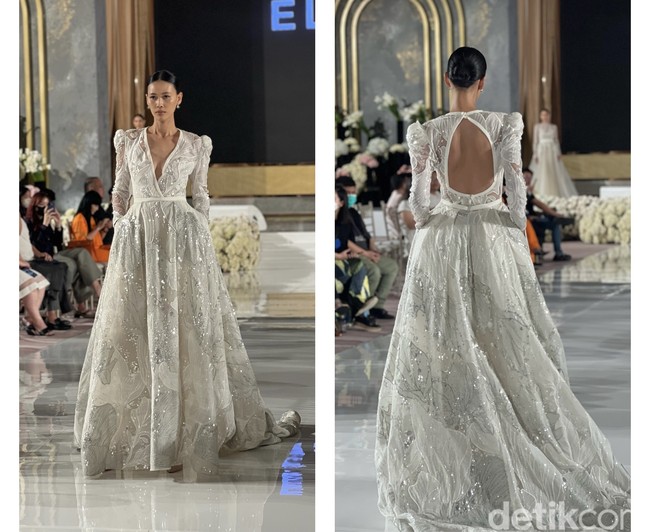 Masih dari rancangan Elie Saab, gaun pengantin dengan aksen berwarna silver yang mengkilap ini akan membuat tampilan terlihat mewah dan elegan. Walaupun tampak tertutup dengan lengan panjang, namun potongan dada berbentuk v yang cukup rendah dan bagian punggung yang terbuka menciptakan sedikit kesan seksi yang tak berlebihan. Foto: Wolipop/Vina Oktiani
