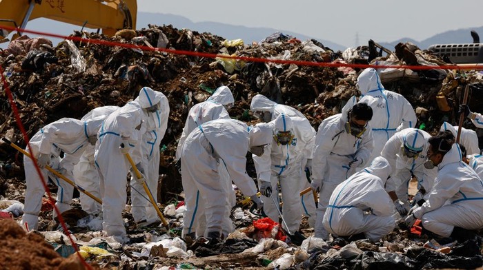 Police excavate a landfill during a search for the missing parts of 28-year-old model Abby Chois body in Hong Kong, China February 28, 2023. REUTERS/Tyrone Siu