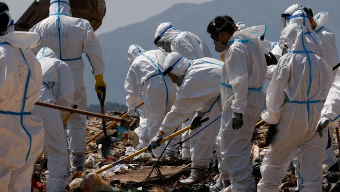 Police excavate a landfill during a search for the missing parts of 28-year-old model Abby Choi's body in Hong Kong, China February 28, 2023. REUTERS/Tyrone Siu