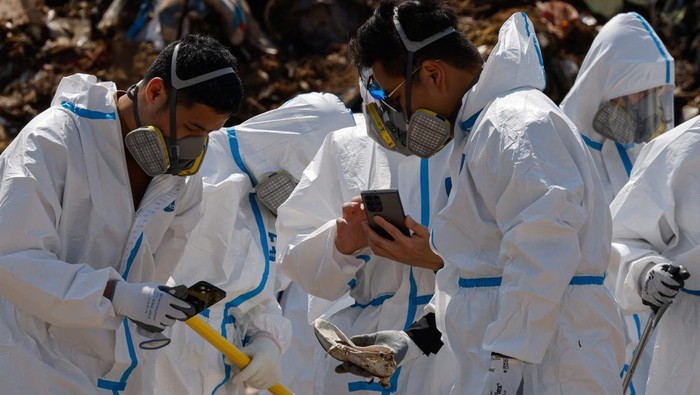 Police excavate a landfill during a search for the missing parts of 28-year-old model Abby Choi's body in Hong Kong, China February 28, 2023. REUTERS/Tyrone Siu