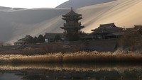 Di sebelah Danau Bulan Sabit terdapat bangunan kuil dengan pagoda. Di sana pula terdapat toko suvenir yang bisa Anda singgahi. Selain memandangi atau memotret Danau Bulan Sabit, biasanya turis yang datang ke sana menjelajahi bukit-bukit pasir dengan unta.