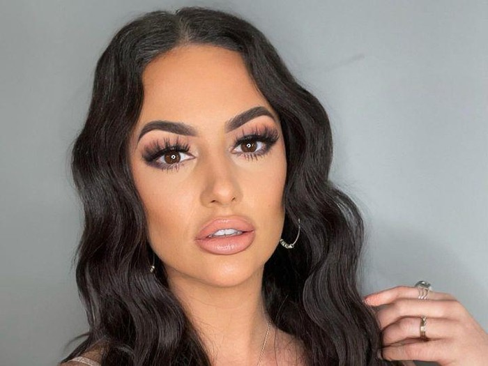 Upset woman crying, seeing her boyfriend with other girl in park