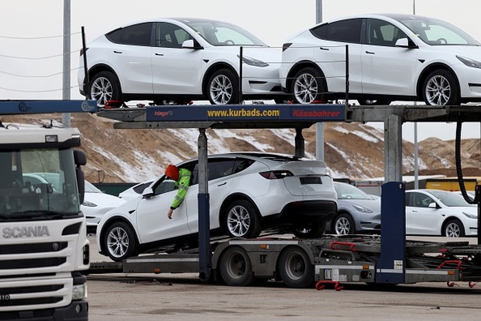 Tesla Model Y electric vehicles in a lot at the Tesla Inc. Gigafactory in Gruenheide, Germany, on Saturday, Jan. 21, 2023. Tesla CEO Elon Musk played down how much impact his tweets have on the companys stock price as he defended himself at a trial in San Francisco federal court on Friday over his 2018 tweet about taking the electric car-maker private. Photographer: Liesa Johannssen/Bloomberg via Getty Images