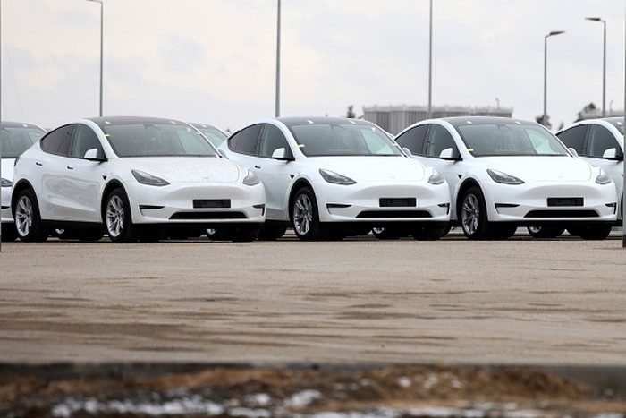 Tesla Model Y electric vehicles in a lot at the Tesla Inc. Gigafactory in Gruenheide, Germany, on Saturday, Jan. 21, 2023. Tesla CEO Elon Musk played down how much impact his tweets have on the companys stock price as he defended himself at a trial in San Francisco federal court on Friday over his 2018 tweet about taking the electric car-maker private. Photographer: Liesa Johannssen/Bloomberg via Getty Images