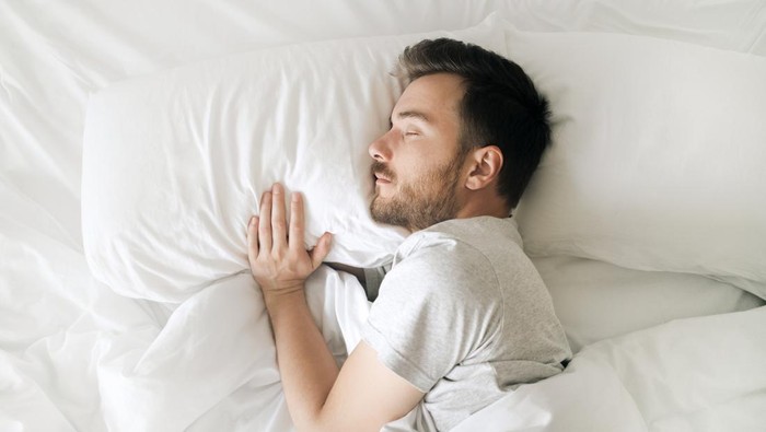 Lifestyle portrait of sleeping man