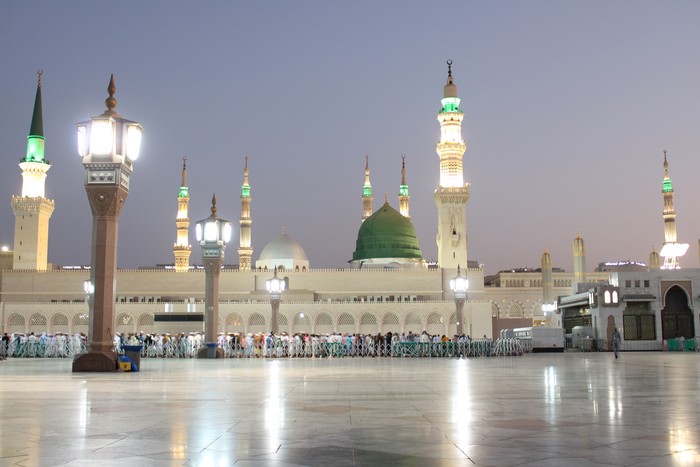 Beautiful morning view of Masjid Al Nabawi, Medinas green dome, minarets and mosque courtyard.