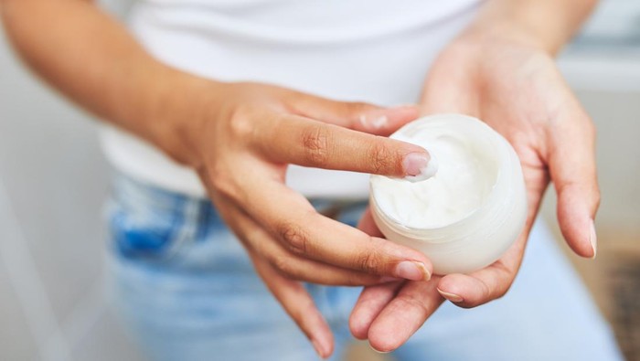 Cropped shot of an unrecognizable man holding moisturizer