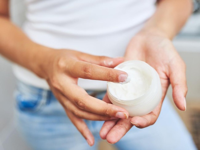 Cropped shot of an unrecognizable man holding moisturizer