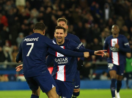 PSGs Lionel Messi, center, celebrates with PSGs Kylian Mbappe after scoring his sides opening goal during the French League One soccer match between Paris Saint-Germain and Nantes at the Parc des Princes in Paris, Saturday, March 4, 2023. (AP Photo/Aurelien Morissard)