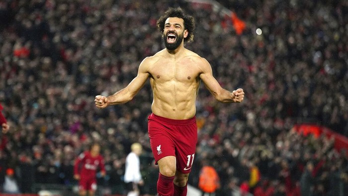 Liverpools Mohamed Salah celebrates after scoring his sides sixth goal during the English Premier League soccer match between Liverpool and Manchester United at Anfield in Liverpool, England, Sunday, March 5, 2023. (Peter Byrne/PA via AP)