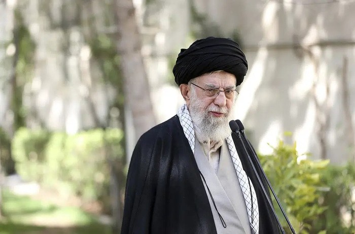 In this picture released by the official website of the office of the Iranian supreme leader, Supreme Leader Ayatollah Ali Khamenei speaks after planting a tree marking National Tree Planting Day, at the courtyard of his office in Tehran, Iran, Monday, March 6, 2023. Khamenei said Monday that if a series of suspected poisonings at girls schools are proven to be deliberate the culprits should be sentenced to death for committing an 