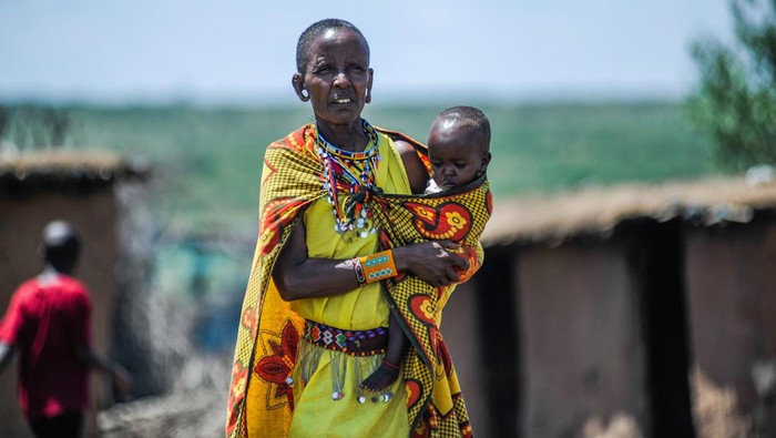 MASAI MARA, KENYA - MARCH 04: People from Masai community, one of the oldest tribes in East Africa, living in a semi-nomadic state, preserving their traditions in Masai Mara, 290 kilometers to Kenya's capital Nairobi are seen during daily life on March 04, 2023. The Masai distinguish themselves from other tribes by eating a lot of meat, wearing distinctive traditional clothing, and utilizing distinctive jewelry. For the Masai people, taking care of animals has religious significance as well. According to their beliefs, the 