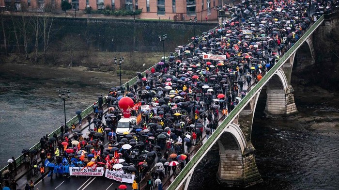 Protesters participate in a demonstration in Toulouse, southwestern France on March 7, 2023, on the sixth day of nationwide rallies organized since the start of the year against French Presidents pension reform and its postponement of the legal retirement age from 62 to 64. - Massive strikes are expected from March 7, 2023, with unions promising to bring the country 