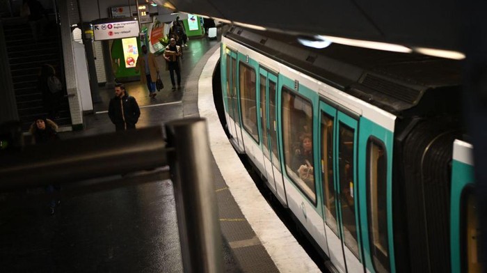 A commuter sits in a carriage at the Gare de l'Est metro station in Paris, on March 7, 2023, as fresh strikes and protests are planned against the government's controversial pensions reform. - Unions have vowed to bring the country to a standstill over the proposed changes, which include raising the retirement age from 62 to 64 and increasing the number of years workers have to make contributions for a full pension. (Photo by Christophe ARCHAMBAULT / AFP) (Photo by CHRISTOPHE ARCHAMBAULT/AFP via Getty Images)