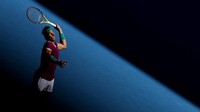 Rafael Nadal dari Spanyol melakukan servis pada pertandingan tunggal putaran kedua melawan Yannick Hanfmann dari Jerman pada Australia Open di Melbourne, Australia. (Darrian Traynor/Getty Images)  
