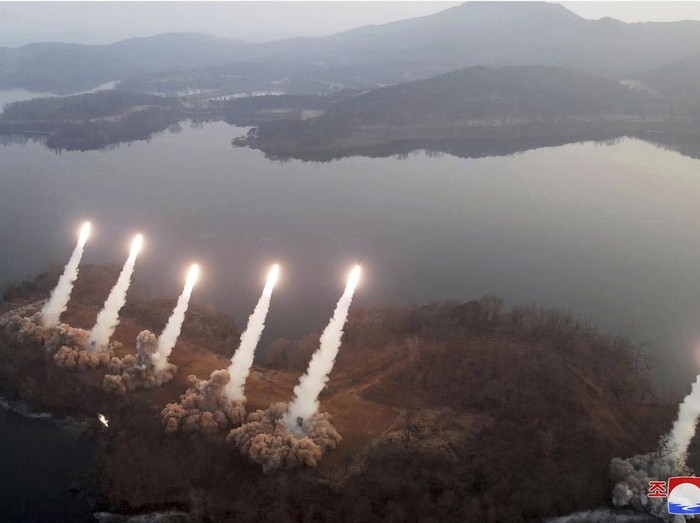In this photo provided by the North Korean government, North Korean leader Kim Jong Un, with his daughter, inspects what it says is an artillery drill at an undisclosed location in North Korea, Thursday, March 9, 2023. Independent journalists were not given access to cover the event depicted in this image distributed by the North Korean government. The content of this image is as provided and cannot be independently verified. Korean language watermark on image as provided by source reads: 