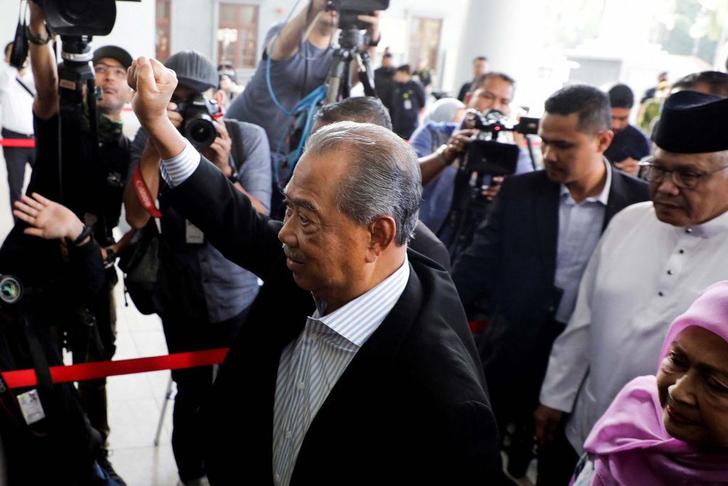 Images of former Malaysian Prime Minister Muhyiddin Yassin are seen on the shirt of his supporters at Kuala Lumpur Court Complex in Kuala Lumpur, Malaysia March 10, 2023. REUTERS/Hasnoor Hussain