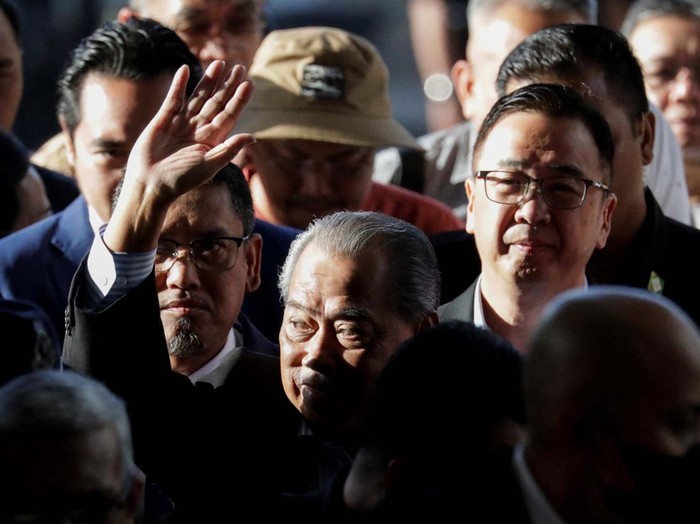 Images of former Malaysian Prime Minister Muhyiddin Yassin are seen on the shirt of his supporters at Kuala Lumpur Court Complex in Kuala Lumpur, Malaysia March 10, 2023. REUTERS/Hasnoor Hussain