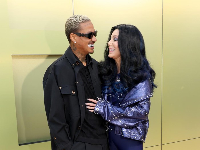 WEST HOLLYWOOD, CALIFORNIA - MARCH 09: (L-R) Alexander Edwards and Cher attend the Versace FW23 Show at Pacific Design Center on March 09, 2023 in West Hollywood, California. (Photo by Kayla Oaddams/FilmMagic )