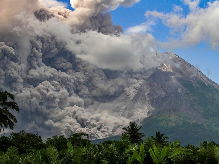 Thick smoke rises during an eruption from Mount Merapi, Indonesias most active volcano, as seen from Tunggularum village in Sleman on March 11, 2023. (Photo by DEVI RAHMAN / AFP) (Photo by DEVI RAHMAN/AFP via Getty Images)